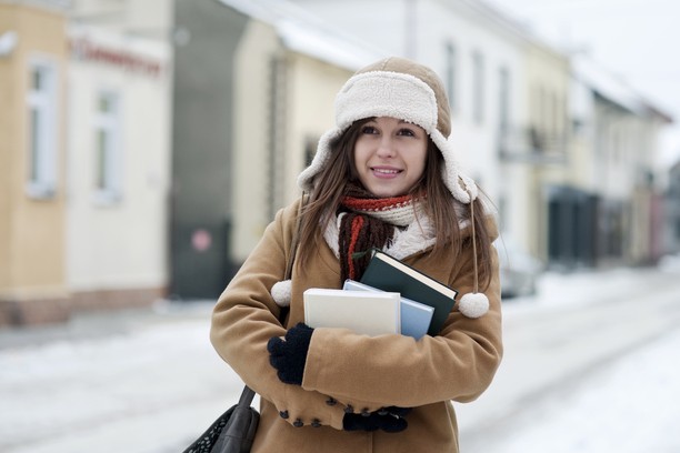Female student with books ready to Study in Canada