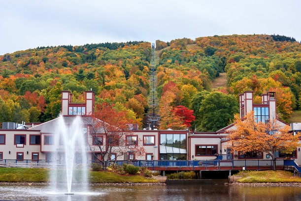 Mountain resort with fall colors and a lake