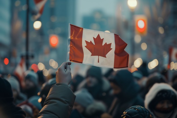 Canada flag in crowd symbolising Canadian immigration programs