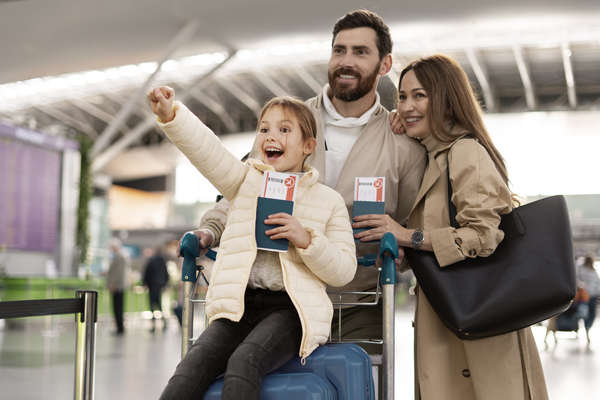Family excited at airport, ready for Canada immigration
