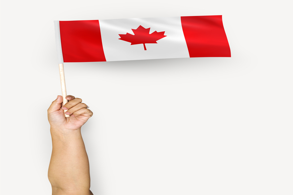 Person waving the flag of Canada